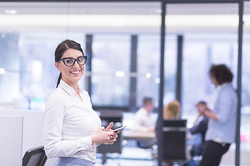 Image showing Elegant Woman Using Mobile Phone in startup office building