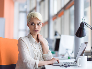 Image showing businesswoman using a laptop in startup office