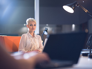 Image showing woman working on laptop in night startup office