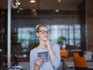 Image showing woman working on digital tablet in night office