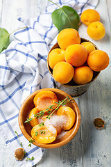 Image showing Apricots for jam with thyme.