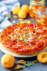 Image showing Homemade tarte tatin pie with apricots and thyme.