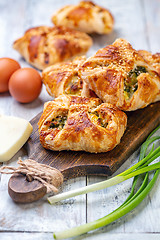 Image showing Homemade puffs with spinach, egg and green onions.