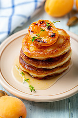 Image showing Delicious pancakes with apricot jam and thyme.