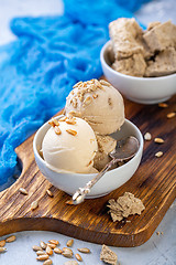 Image showing Ice cream with seeds and halva in a white bowl.