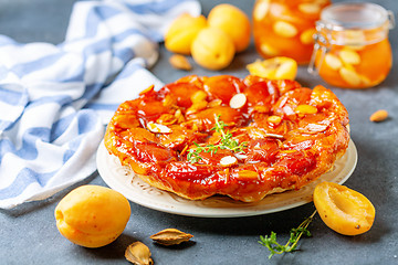 Image showing Apricot tarte tatin pie with thyme and almonds.