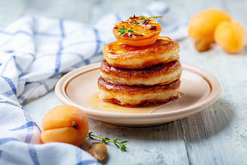 Image showing Fritters with apricot jam and thyme for breakfast.