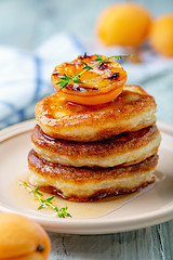 Image showing Pancakes with apricot jam and thyme for breakfast.