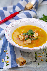 Image showing Plate of thick pea soup with croutons.