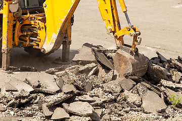 Image showing Tractor Dismantles Asphalt