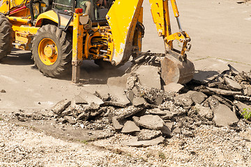 Image showing Tractor Dismantles Asphalt