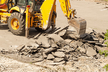 Image showing Tractor Dismantles Asphalt