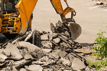 Image showing Tractor Dismantles Asphalt