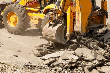 Image showing Tractor Dismantles Asphalt