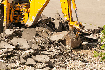 Image showing Tractor Dismantles Asphalt