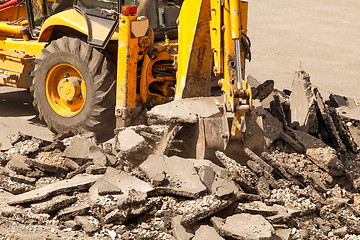 Image showing Tractor Dismantles Asphalt