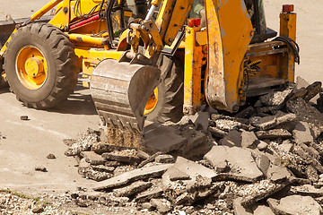 Image showing Tractor Dismantles Asphalt