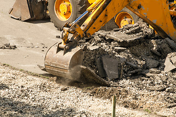 Image showing Tractor Dismantles Asphalt