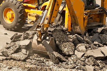 Image showing Tractor Dismantles Asphalt