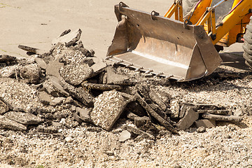 Image showing Tractor Dismantles Asphalt