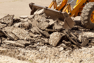 Image showing Tractor Dismantles Asphalt