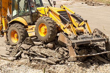 Image showing Tractor Dismantles Asphalt