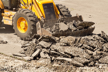 Image showing Tractor Dismantles Asphalt