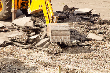 Image showing Tractor Dismantles Asphalt