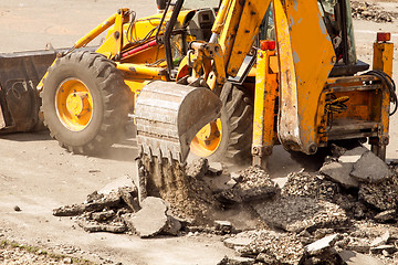 Image showing Tractor Dismantles Asphalt