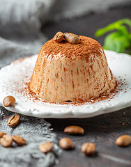 Image showing Coffee Panna cotta sprinkled with cocoa powder.