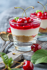 Image showing Cheesecake with cherry jelly in a glass close-up.