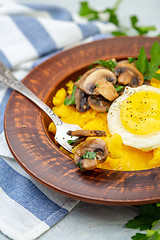 Image showing Delicious polenta with mushrooms and egg.