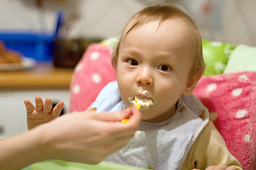 Image showing Mother Feeding Small Baby