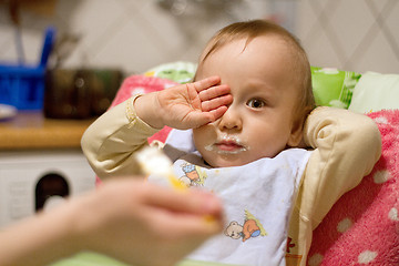 Image showing Mother Feeding Small Baby