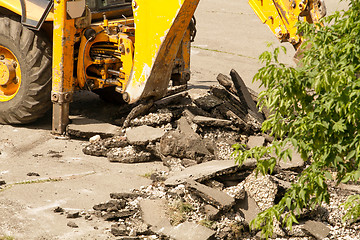 Image showing Tractor Dismantles Asphalt