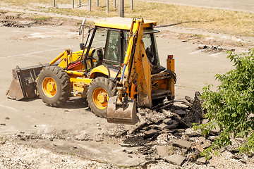 Image showing Tractor Dismantles Asphalt