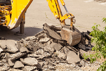 Image showing Tractor Dismantles Asphalt