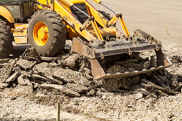 Image showing Tractor Dismantles Asphalt