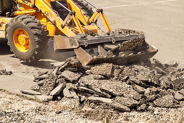 Image showing Tractor Dismantles Asphalt