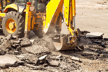 Image showing Tractor Dismantles Asphalt