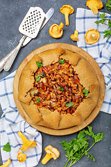 Image showing Open pie (Galette) with wild chanterelles.