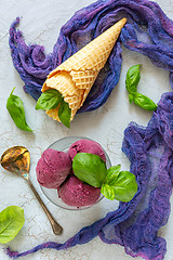 Image showing Artisanal blueberry ice cream with green basil.