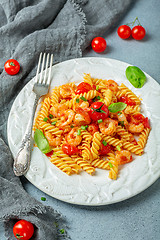 Image showing Tomato pasta fusilli with prawns.