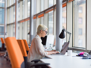 Image showing businesswoman using a laptop in startup office