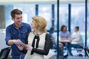 Image showing Business People Working With Tablet in startup office