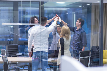 Image showing startup Group of young business people celebrating success