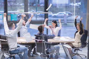 Image showing startup Group of young business people throwing documents