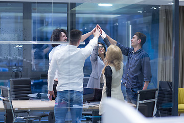 Image showing startup Group of young business people celebrating success