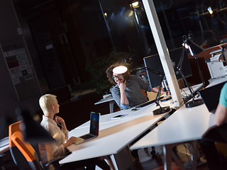 Image showing designers in the night startup office