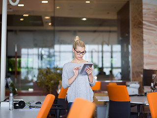 Image showing woman working on digital tablet in night office